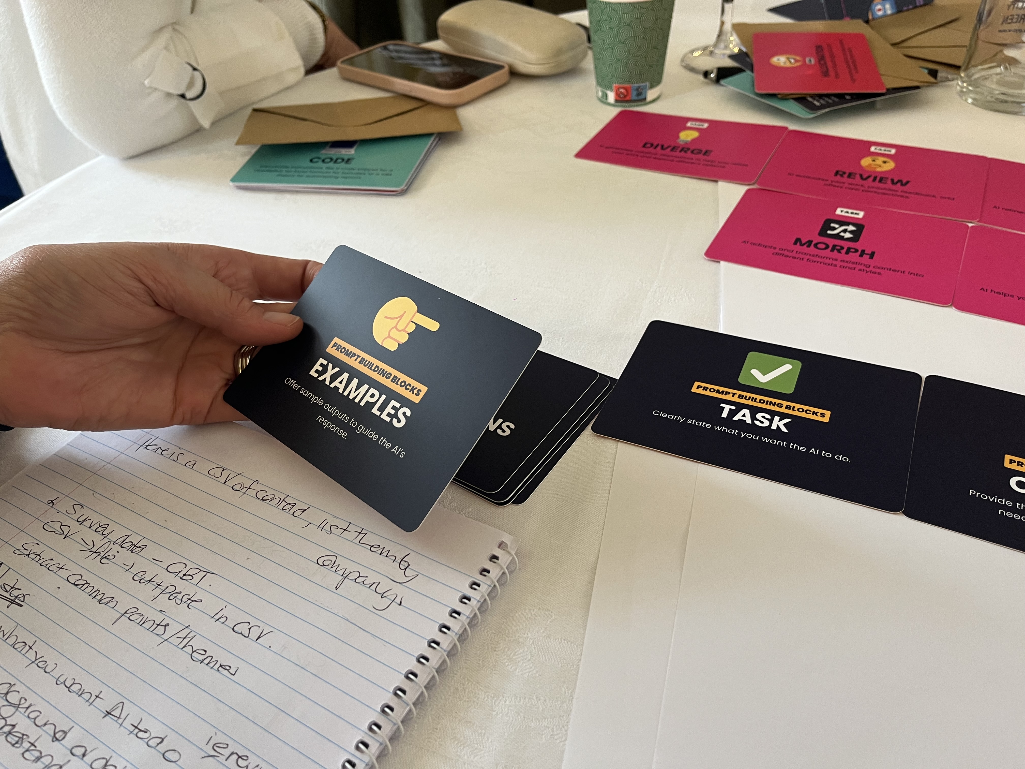 Photo of hands manipulating the building block cards from the AI Tinkerer's Cards